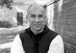 Thomas Merton standing outside 