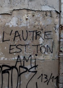 graffiti in Paris that says L'Autre est ton ami, or the other is my friend.