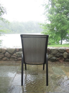 Chair in rain on patio