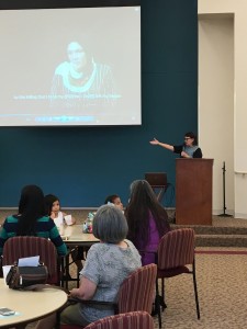 Project Director of the Columbus Crossing Borders Project speaking to audience